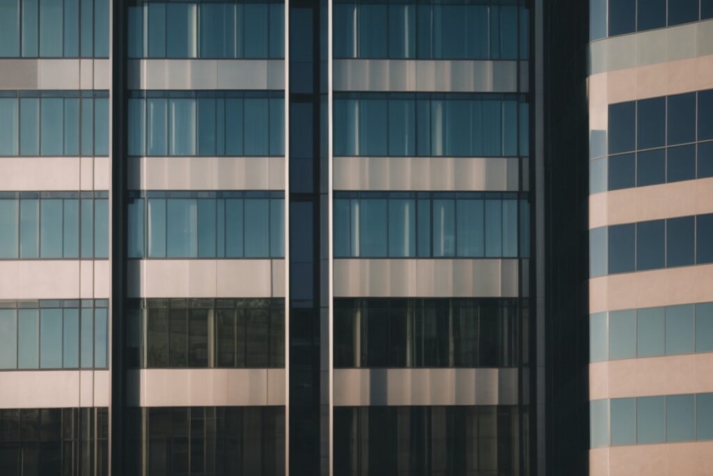 Modern office building in Phoenix with tinted glass windows reflecting sunlight